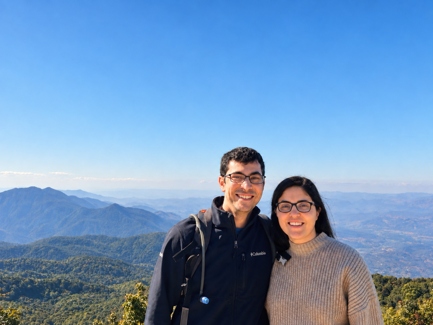 Guy and Liron smiling together in the mountains
